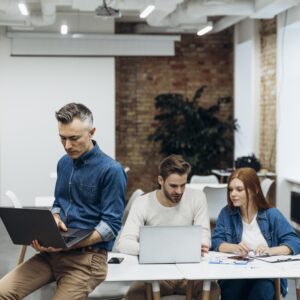 coworkers-discussing-business-project-indoors