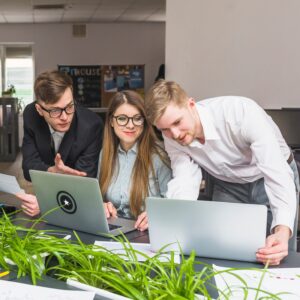 group-businesspeople-working-laptop-office_23-2147838544